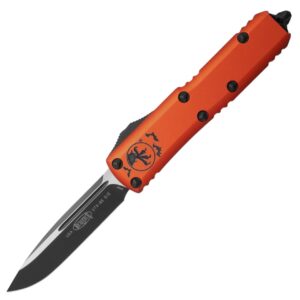 Нож Microtech UTX-85 Halloween Orange с клинком Drop Point и алюминиевой рукоятью
